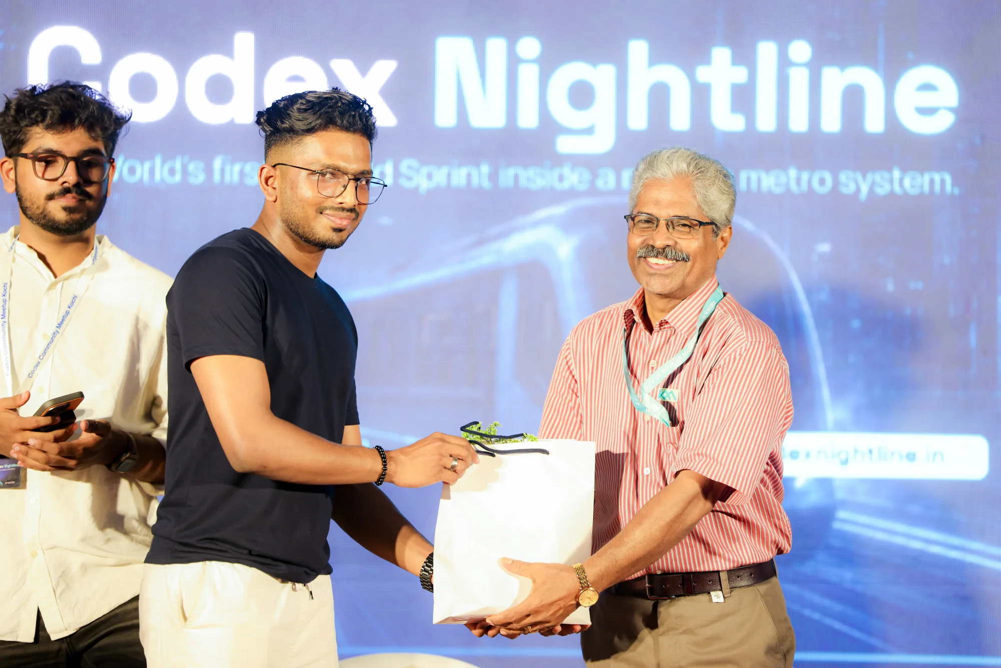 A Codex Nightline participant receiving recognition on stage